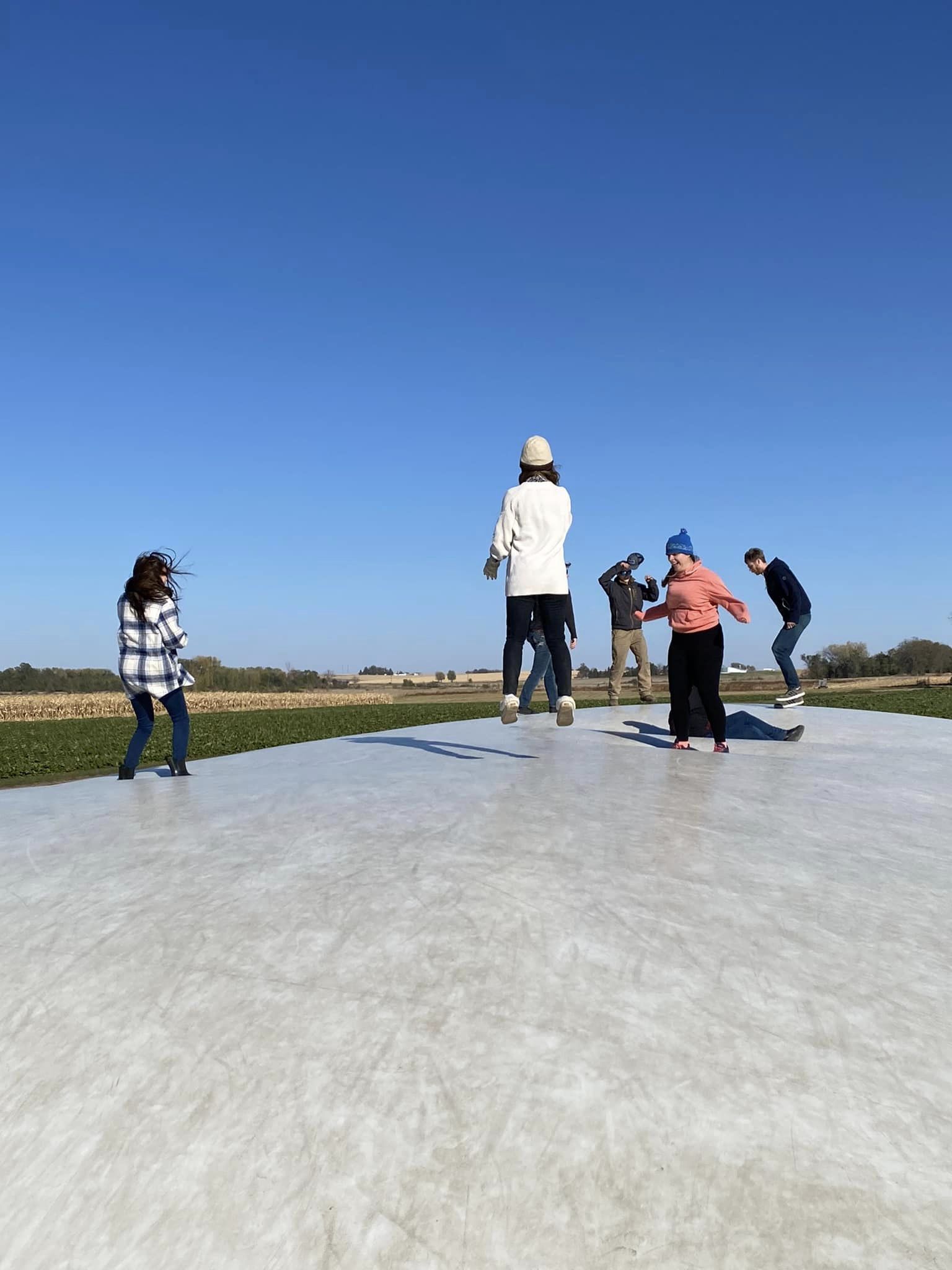 Each month, our corporate team has an outing to bond as a team. In October, we went to Heartland Farms Waterloo and got to be like kids again! Team bouncing on the white blob at a pumpkin patch