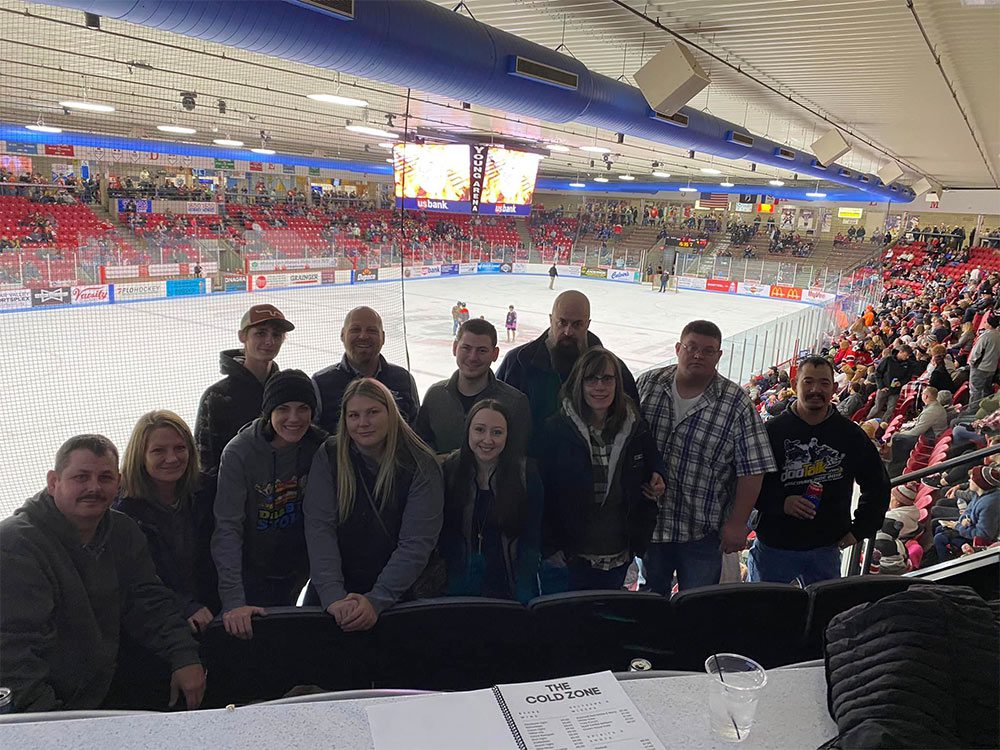 The Single Speed Suite at Young Arena was the perfect spot to watch the Waterloo Black Hawks get a win! Team posing with ice arena behind them